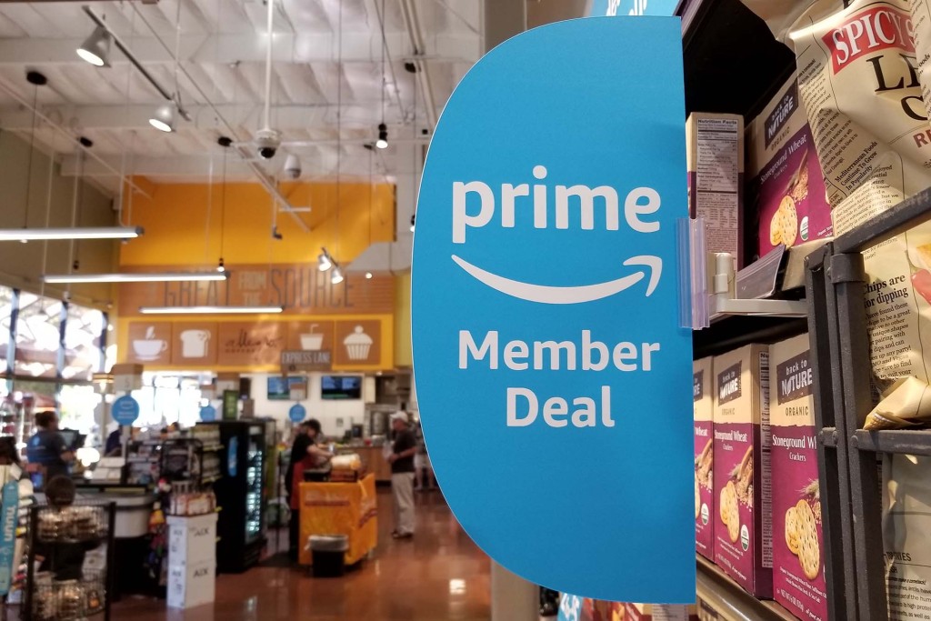 Prime Member Deal signage on the aisle of an Amazon-owned Whole Foods market