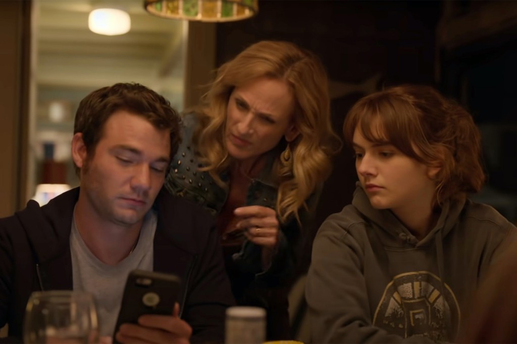 Leo (Daniel Durant), Jackie (Marlee Matlin) and Ruby (Emilia Jones) swipe left on Tinder profiles in the movie "CODA."