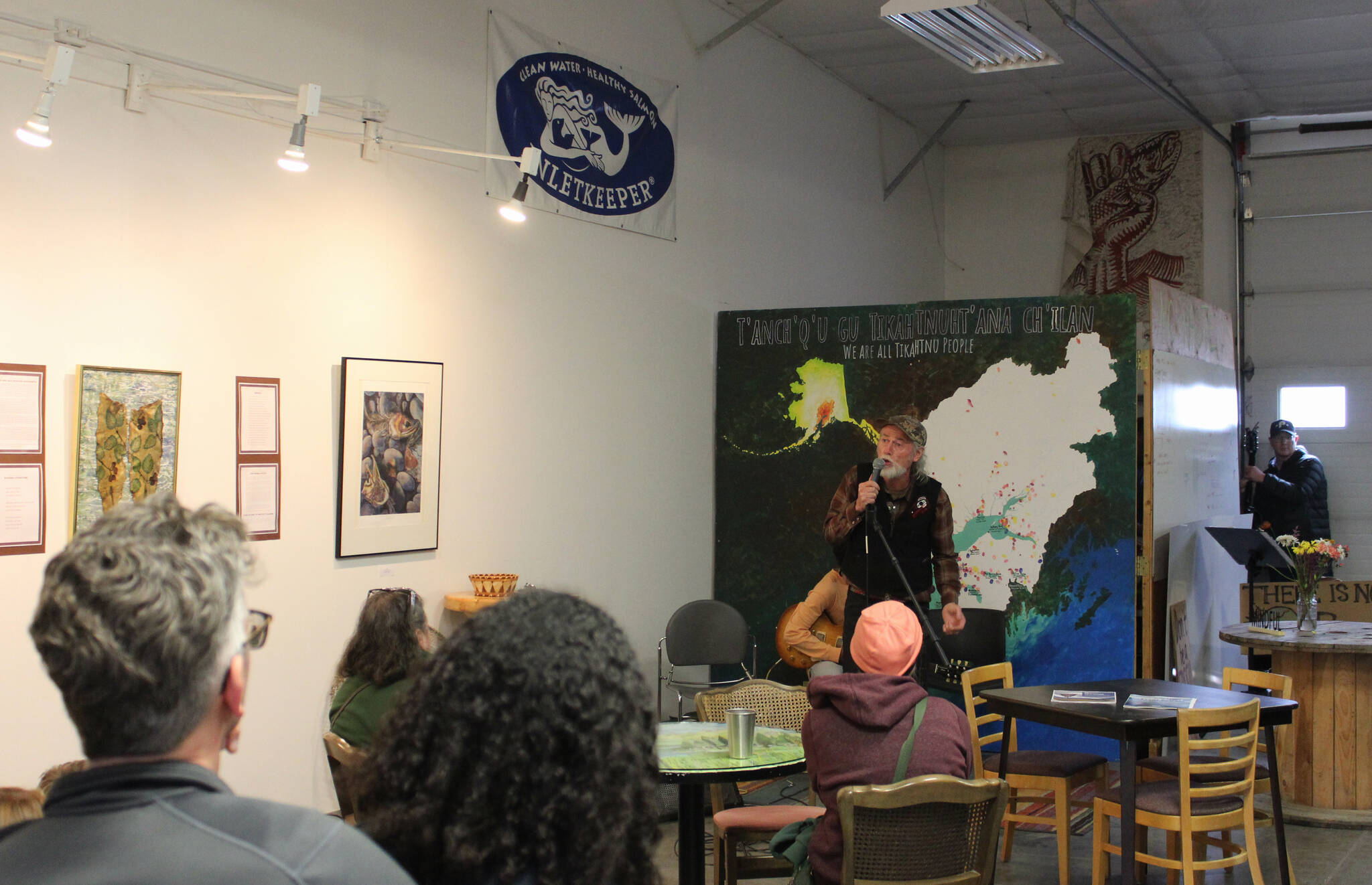 Steve M. Schoonmaker recites poetry as part of the opening of his show Symbiotic Symphony: Alders and Salmon at Cook Inletkeepers Community Action Studio on Friday, April 22, 2022, in Soldotna, Alaska. (Ashlyn OHara/Peninsula Clarion)