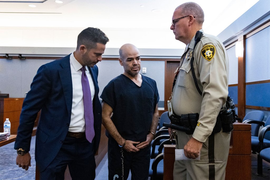 Robert Telles, center, leaves the courtroom with David Lopez-Negrete, a public defender, left, after his arraignment at the Regional Justice Center on Sept. 20, 2022 in Las Vegas.